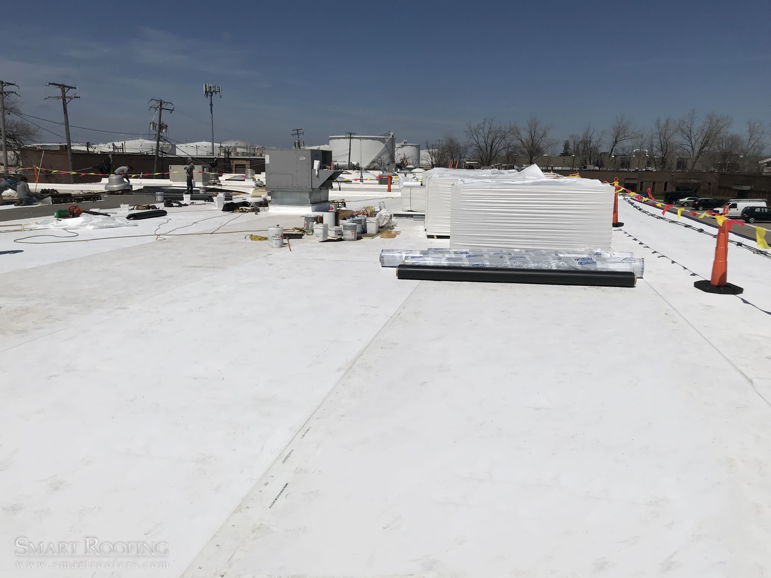 Commercial TPO single-ply membrane roof installation on a flat commercial building